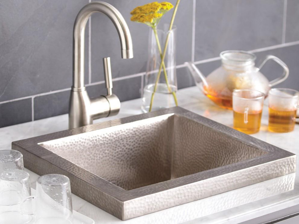 Hand hammered copper drop-in bar sink