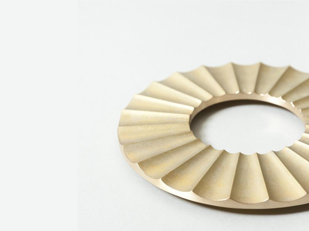 Solid brass trivets with crude casting surface