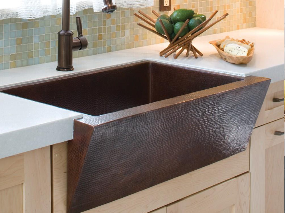 Hand hammered copper farmhouse sink for the kitchen